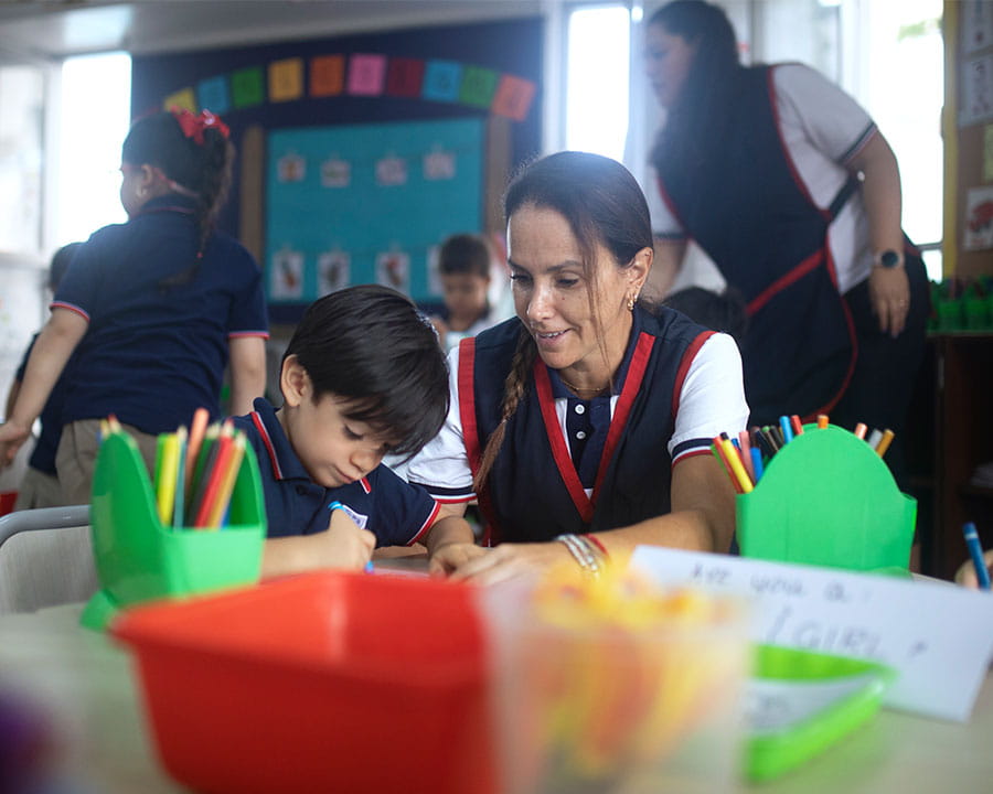 Early years student with his teacher