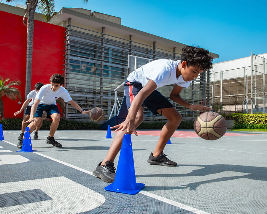 A boy dribbling a basketball